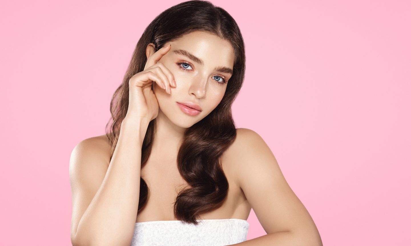 Woman with smooth forehead and refreshed brows after facial rejuvenation