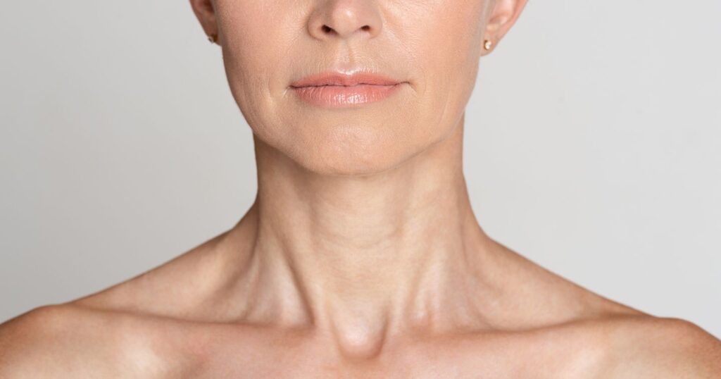 elegant mature woman with smooth youthful jawline and neck after facelift